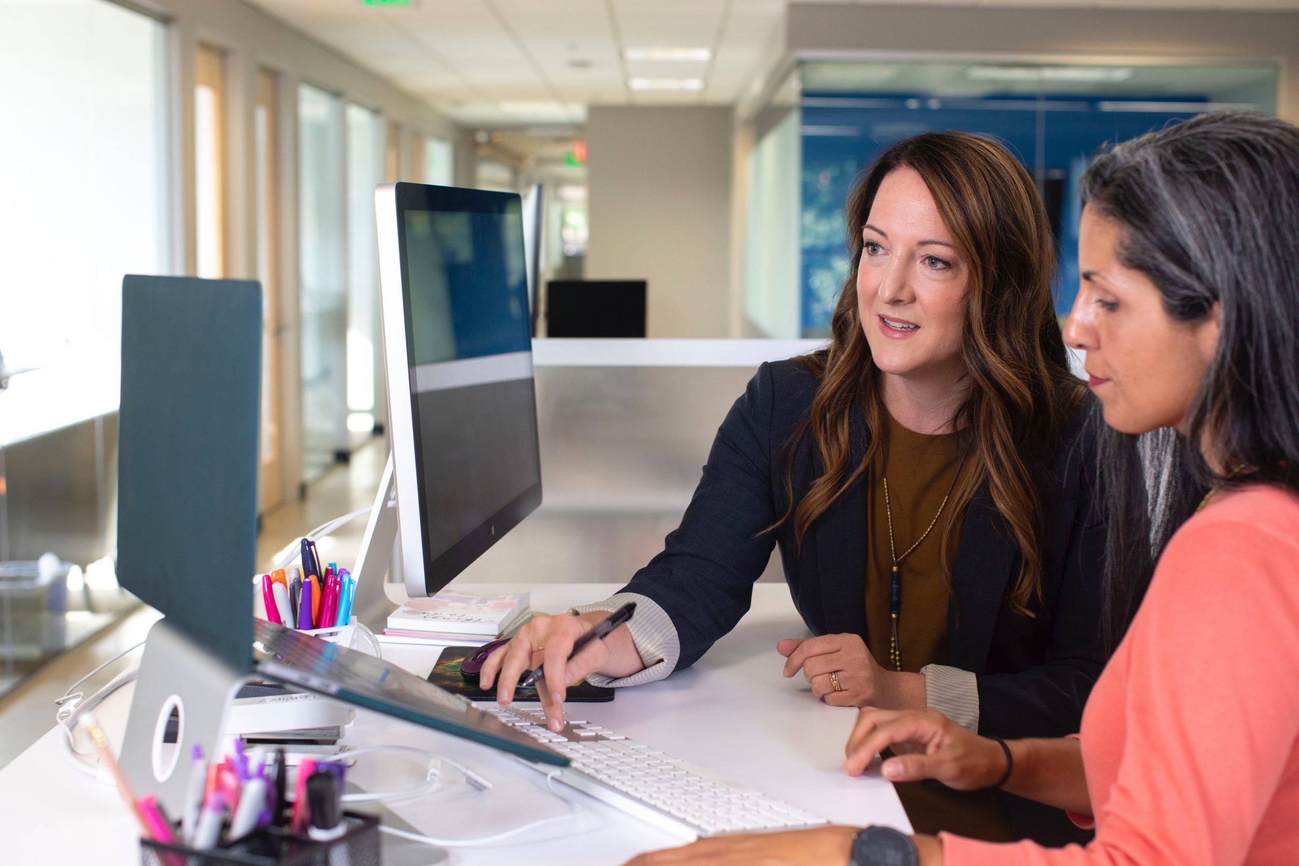Photo by LinkedIn Sales Navigator woman in black blazer sitting at the table